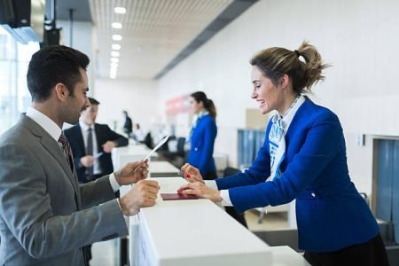 Business man in check-in counter with boarding pass.